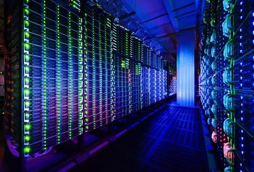 Row of mining machines operating in a professionally managed hosting facility